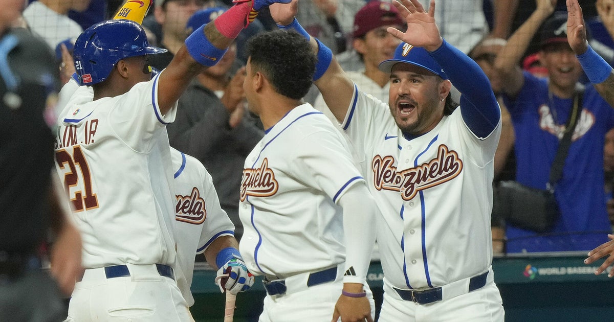 Thousands of Venezuelan fans celebrate their team during the opening game of the World Baseball Classic in Miami