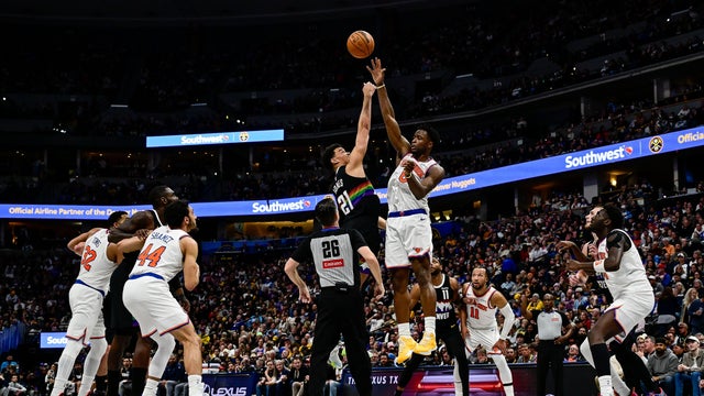 Og Anunoby #8 of the New York Knicks wins a jump ball against Spencer Jones #21 of the Denver Nuggets in the second half of the game at Ball Arena on March 6, 2026 in Denver, Colorado. 