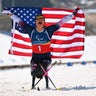 Oksana Masters of Team USA celebrates after winning gold in the Para cross-country skiing sprint sitting final at the Paralympics, March 10, 2026, in Val di Fiemme, Italy. 