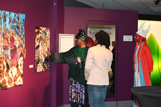 People pose for photos during an event at the National Liberty Museum 
