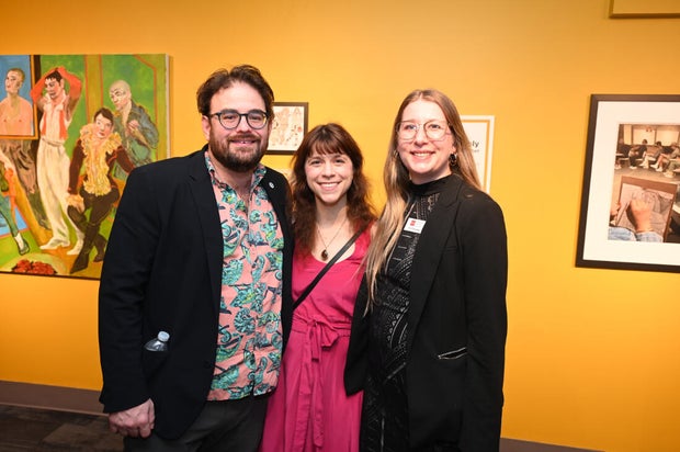 People pose for photos during an event at the National Liberty Museum 