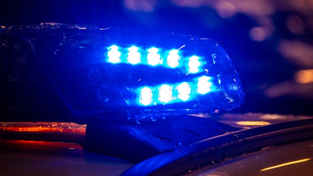 Police car with focus on siren lights. Beautiful siren lights activated in full mission activity. Policemen with patrol car in intervention operation at crime place. Emergency lights flashing on patrol car. 