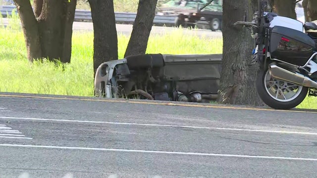 Police patrol car with sirens off during a traffic control. Blue and red flashing sirens of police car during the roadblock in the city. 