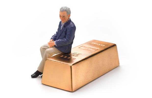 Wedding Figurine Retired Man sitting on gold bar 