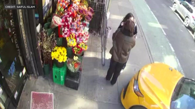 A taxi about to strike to women standing on a sidewalk 