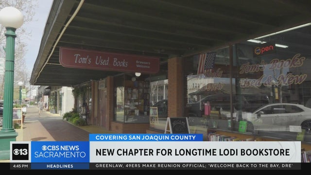 a storefront with a sign that says Tom's Used Books 