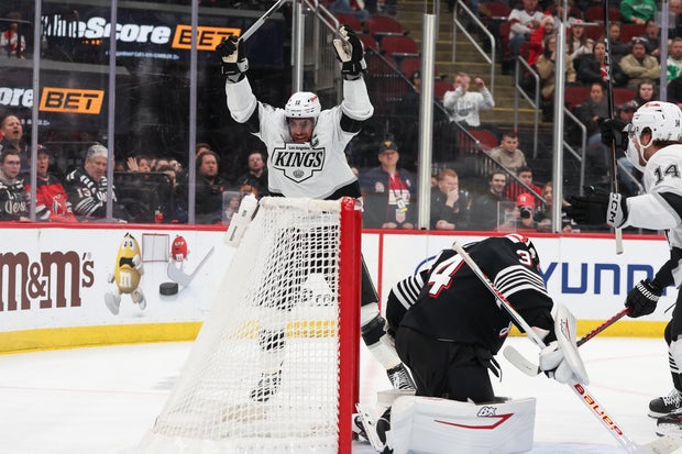 Anze Kopitar #11 of the Los Angeles Kings scores a goal on Jake Allen #34 of the New Jersey Devils during the third period of a NHL game breaking the franchise record for points (1308) against the New Jersey Devils at Prudential Center on March 14, 2026 in Newark, New Jersey.