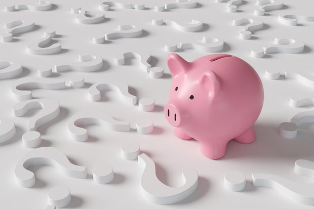 Pink piggy bank standing among white question marks on white background. Illustration of the concept of investment strategies and economic forecast 