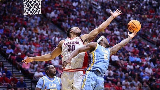 Mason Porter-Brown #6 of the Long Island University Sharks and Tobe Awaka #30 of the Arizona Wildcats reach for a rebound during the second half during the first round of the 2026 NCAA Men's Basketball Tournament held at Viejas Arena at San Diego State University on March 20, 2026 in San Diego, California. 