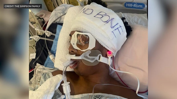 Justin Simpson in hospital bed 