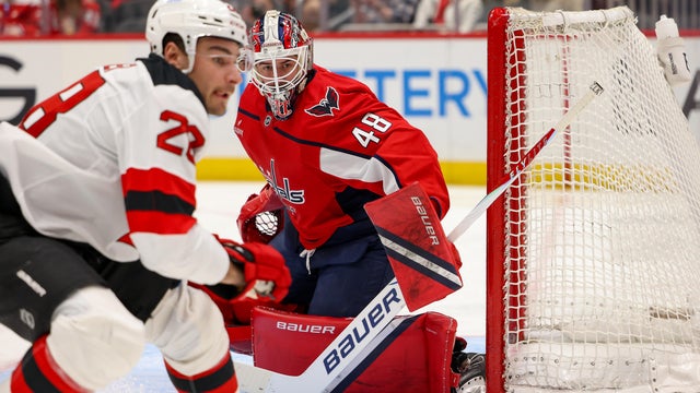 Logan Thompson #48 of the Washington Capitals watches the puck after a save during a game against the New Jersey Devils at Capital One Arena on March 20, 2026 in Washington, D.C. 