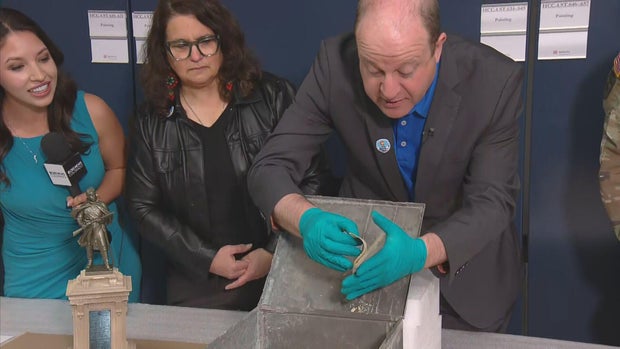Gov. Polis opens time capsule found under Civil War statue 