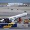 Wreckage of crashed Air Canada plane being cleared from LaGuardia Airport runway