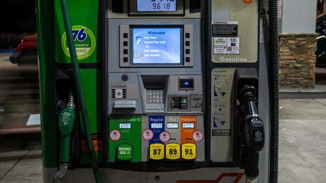 Oil crisis raises price of diesel and gasoil - a woman filling the gas tank 