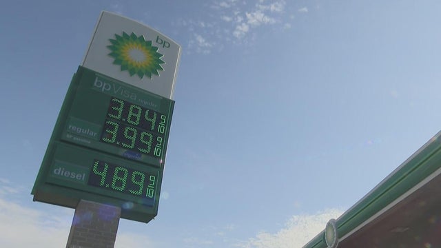 Oil crisis raises price of diesel and gasoil - a woman filling the gas tank 