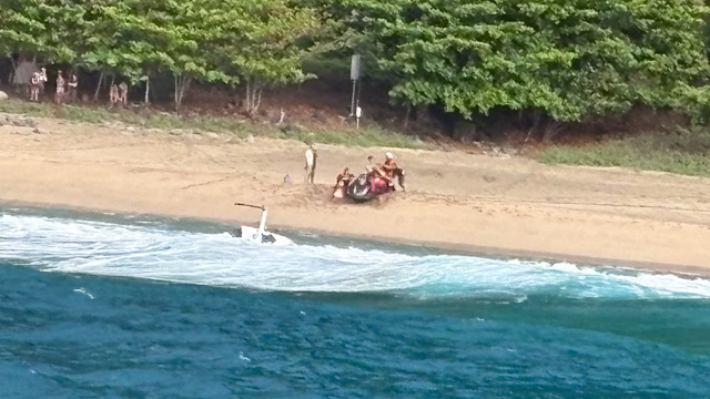 Police light on a car with passenger aircraft in the sky 
