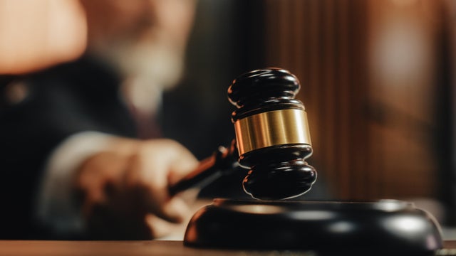 Court of Law and Justice Trial Session: Imparcial Honorable Judge Pronouncing Sentence, striking Gavel. Focus on Mallet, Hammer. Cinematic Shot of Dramatic Not Guilty Verdict. Close-up Shot. 