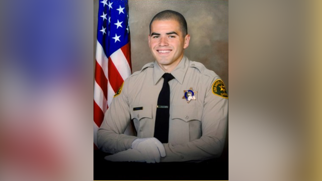 An Officer with the Los Angeles County Sheriff's Department who knew Sorensen wears a black band ove 