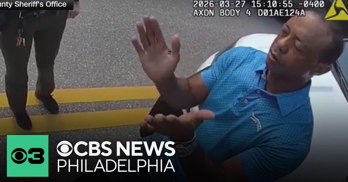 New video shows Tiger Woods during arrest after crash in Florida - CBS ...