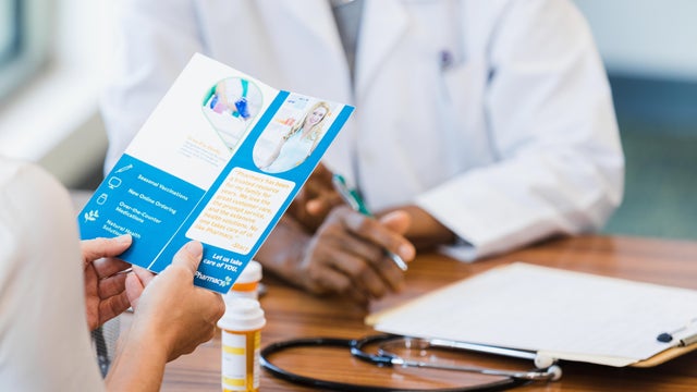Man completing paperwork at medical appointment 