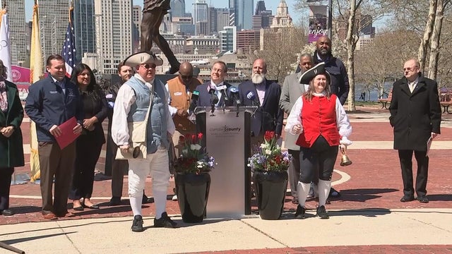 A town crier and other local leaders at a press conference in Camden, New Jersey 