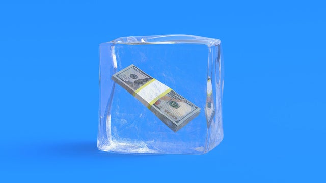 Dollar banknotes in ice cube. 3d illustration 