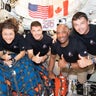 From left, Artemis II crewmates Christina Koch, Jeremy Hansen, Victor Glover and Reid Wiseman pause for a group photo inside the Orion spacecraft on their way home in this handout image provided by NASA. 
