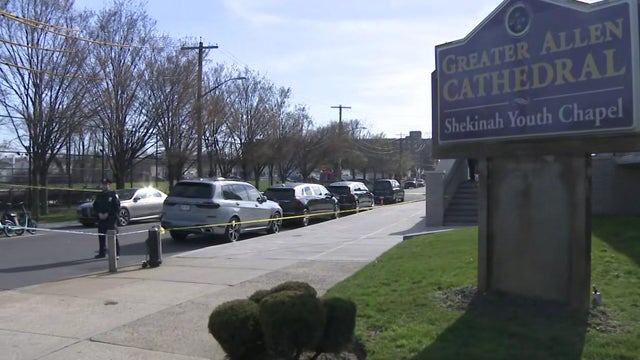 Crime scene tape and police vehicles near church 