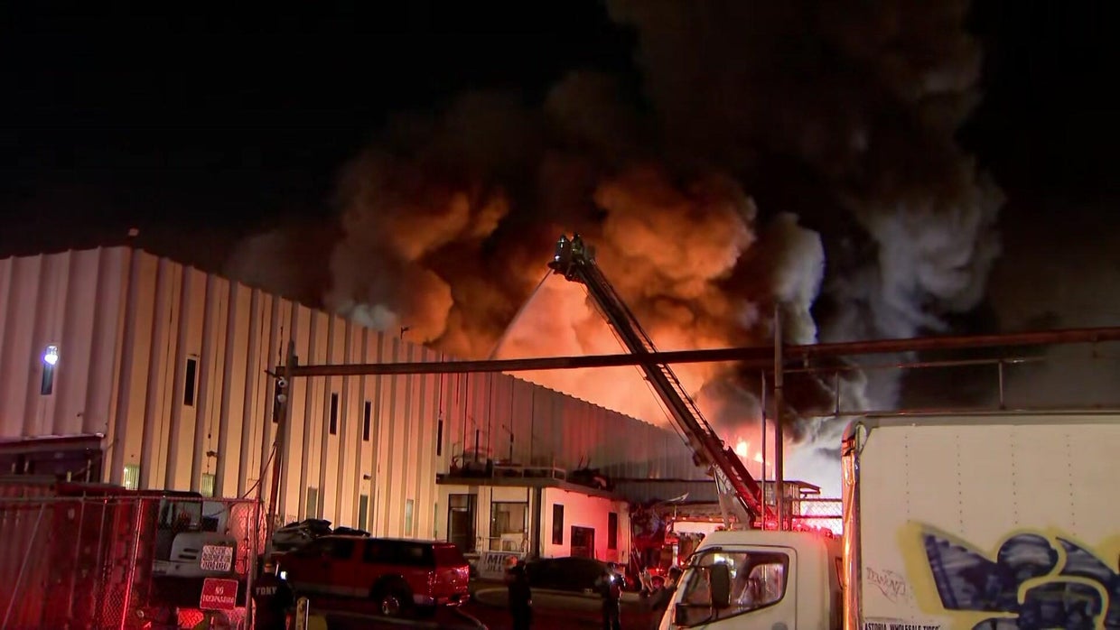 FDNY crews battle massive factory fire in Queens - CBS New York