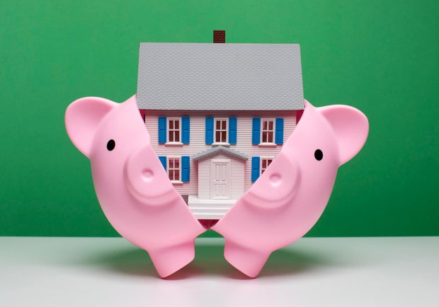 Saving for a home - House in piggy bank