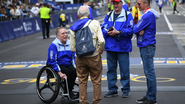 (4/17/06-Boston, MA)  110th Annual Boston Marathon:  Ernst Van Dyk of South Africa, right, shakes hands with former wheelchair winner Bob Hall after he won the mens wheelchair division of the 110th running of the Boston Marathon      (Staff Photo By 