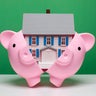 Saving for a home - House in piggy bank 
