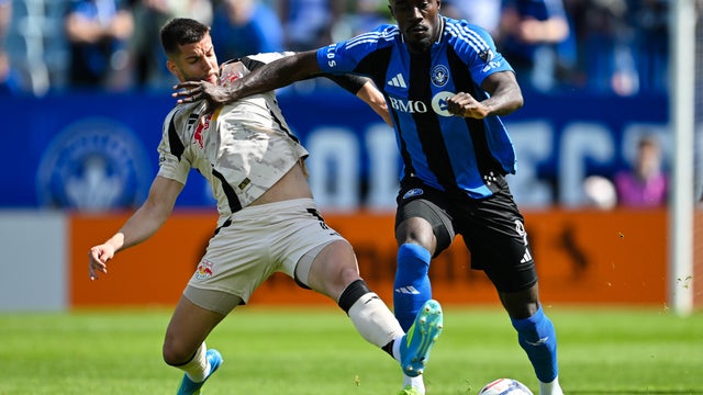 Robert Voloder #6 of Red Bull New York challenges Prince Owusu #9 of CF Montr&eacute;al during the MLS match in the first half at Saputo Stadium on April 18, 2026 in Montreal, Quebec, Canada. 