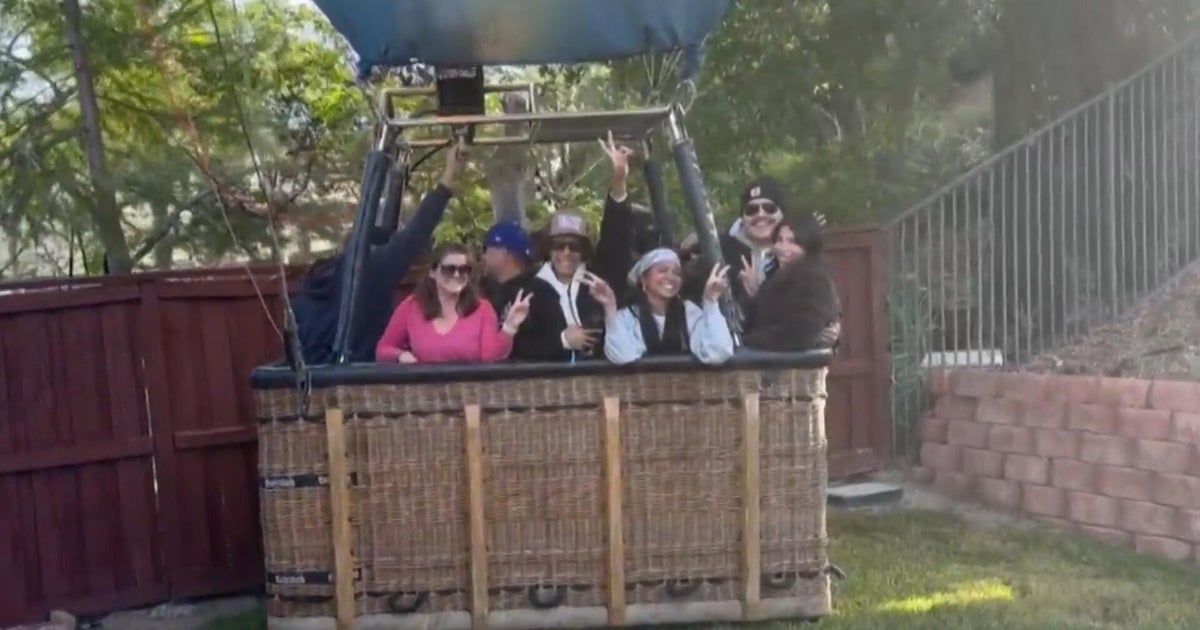 Pilot of hot air balloon carrying 13 people makes emergency landing in California backyard