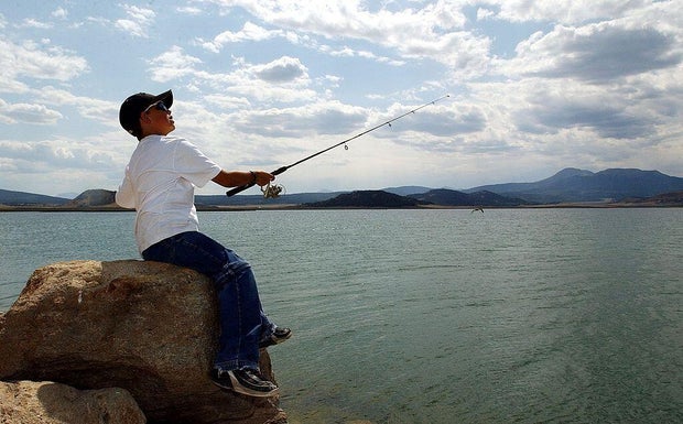 ANTERO RESERVOIR,CO--Mitch Snow, 11, from Colorado Springs, casts his line into the south shore of Antero Reservoir, just south of Fairplay Wednesday afternoon with hopes of catching his limit of trout fish. The Denver Water Board wants to drain the reser 