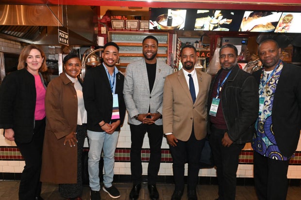 People post for photos at the WTC Greater Philadelphia Global Forum 