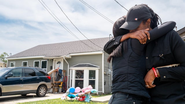 Relatives gather while grieving the death of family members in Shreveport 