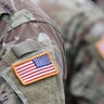 US soldiers. US army. USA patch flag on the US military uniform. United States Armed Forces. Veterans Day. 
