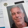 Documents that were included in the Department of Justice release of the Jeffrey Epstein files are photographed Friday, Jan. 2, 2026. 