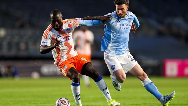K&eacute;vin Denkey #9 of FC Cincinnati and Aiden O'Neill #21 of New York City FC battle for possession during the first half at Yankee Stadium on April 22, 2026 in New York, New York. 