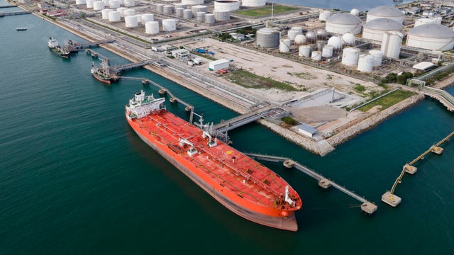 Aerial View of Crude Oil Tanker and Storage Tanks 