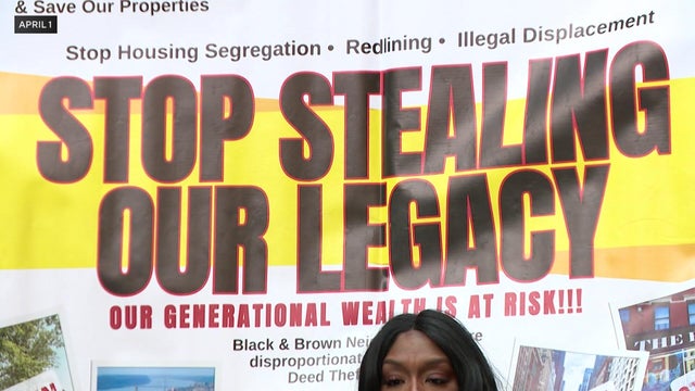"Stop stealing our legacy" banner 