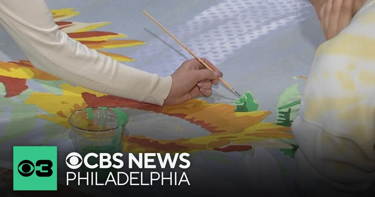 Community paint day honors LGBTQ+ trailblazers in Philadelphia during Black Pride celebration