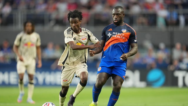 K&eacute;vin Denkey #9 of FC Cincinnati passes the ball against Mohammed Sofo #37 of Red Bull New York during the first half of an MLS soccer match at TQL Stadium on April 25, 2026 in Cincinnati, Ohio. 