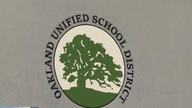 a logo of the Oakland Unified School District 