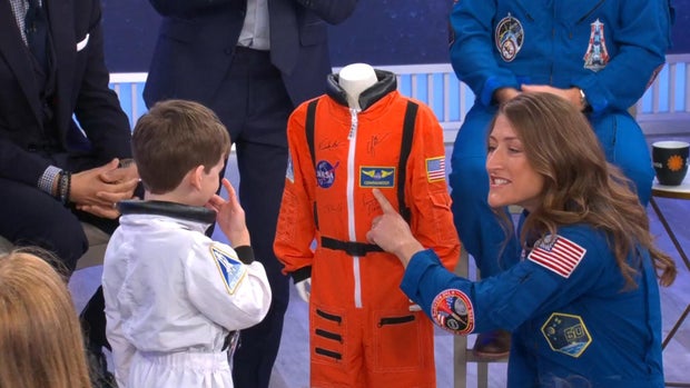 Artemis II mission specialist Christina Koch gives 5-year-old Jack a spacesuit May 1, 2026. 