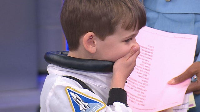 Jack, a 5-year-old boy from Atlanta, reacts to being given a spacesuit from the Artemis II crew, May 1, 2026. 