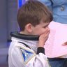 Jack, a 5-year-old boy from Atlanta, reacts to being given a spacesuit from the Artemis II crew, May 1, 2026. 