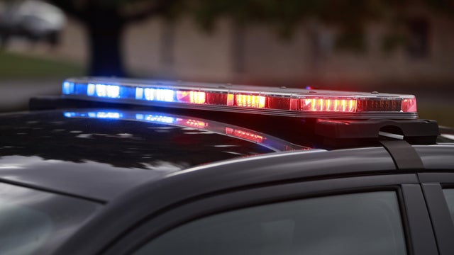 Police LED lights flashing at the scene of a shooting 