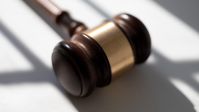 judge's traditional wooden gavel on white background & shadow detail 